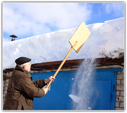 A Minnesota Home having the Snow Removed from the Roof.